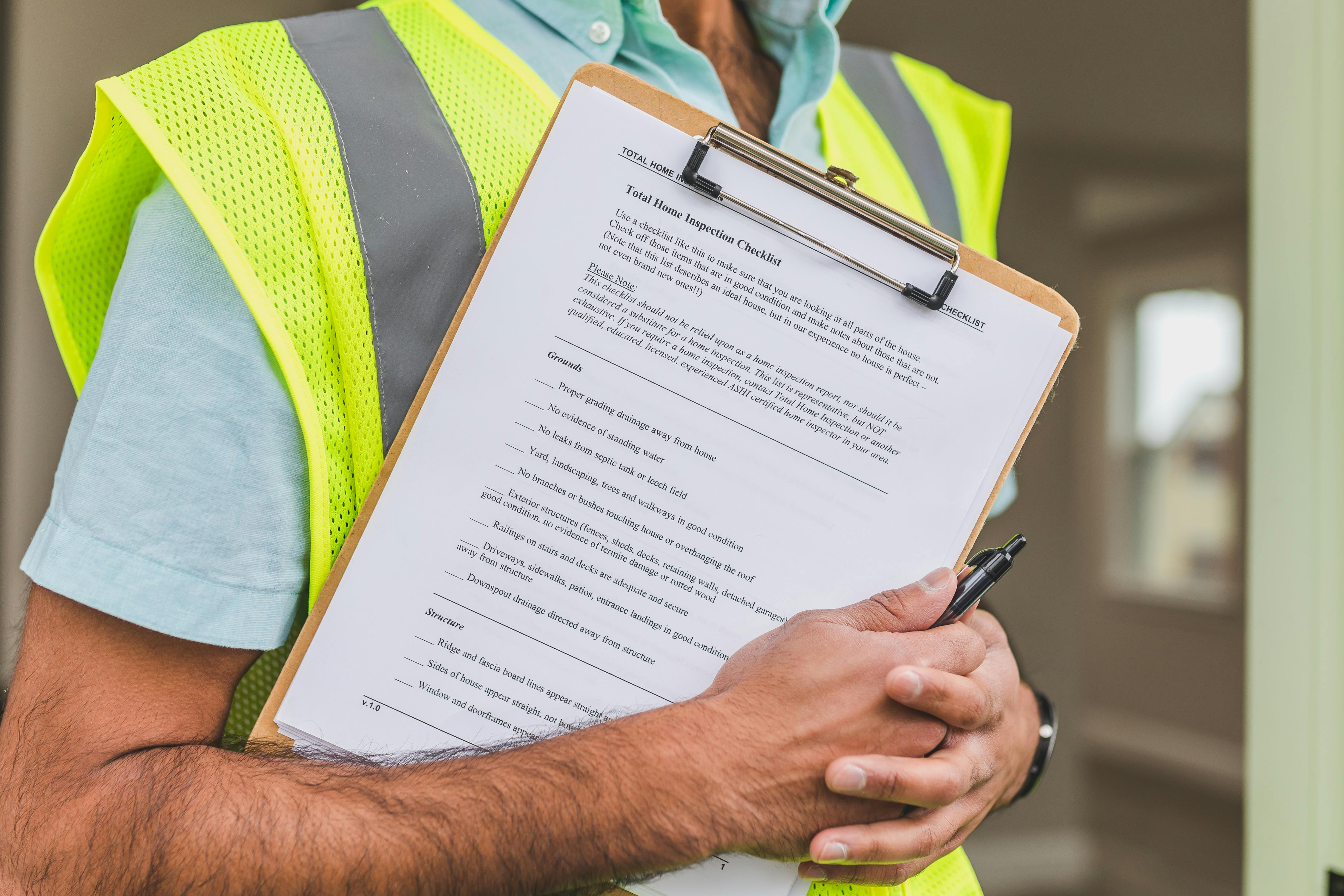 Professional inspector reviewing detailed inspection checklist